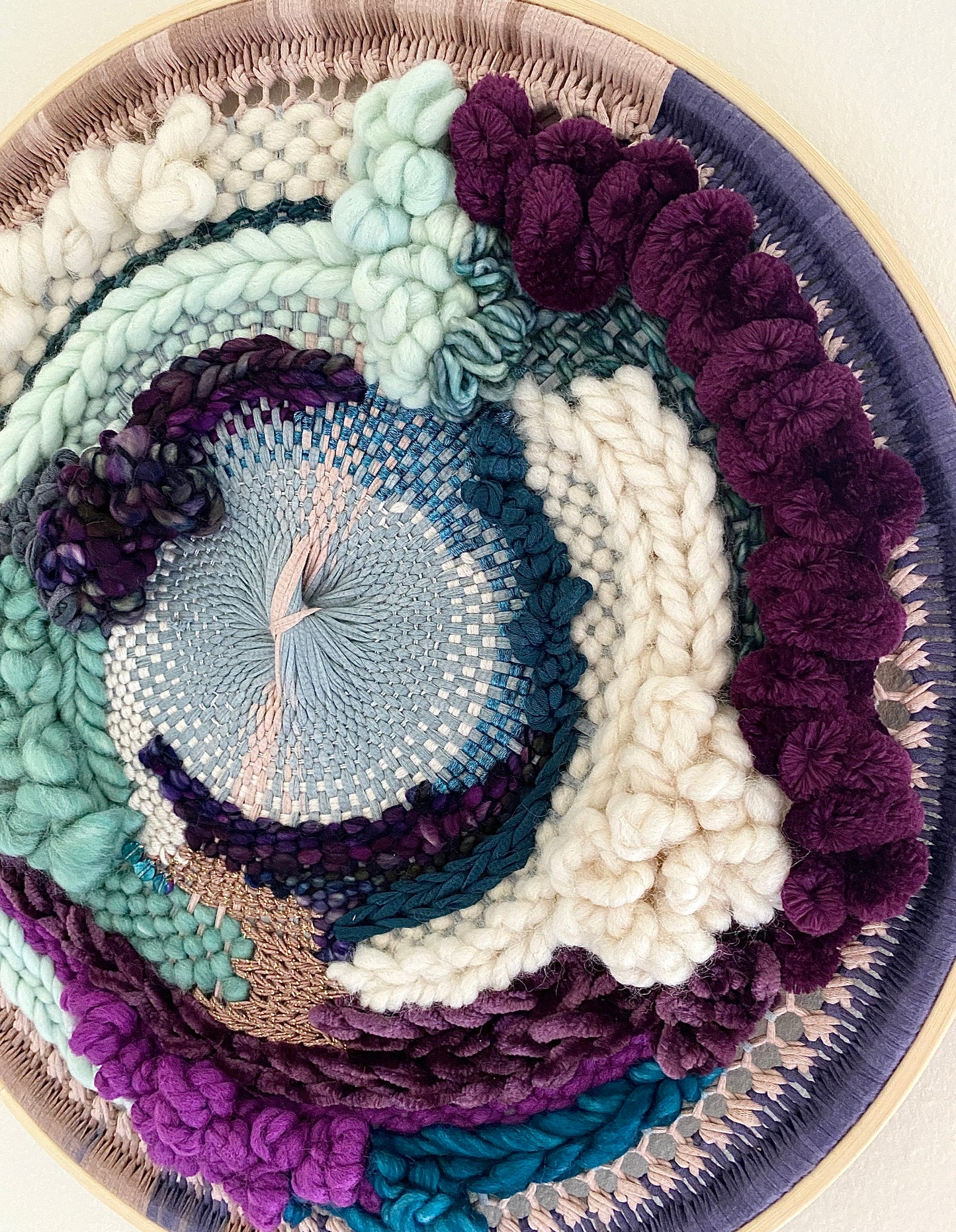Plum clouds round woven wall hanging
