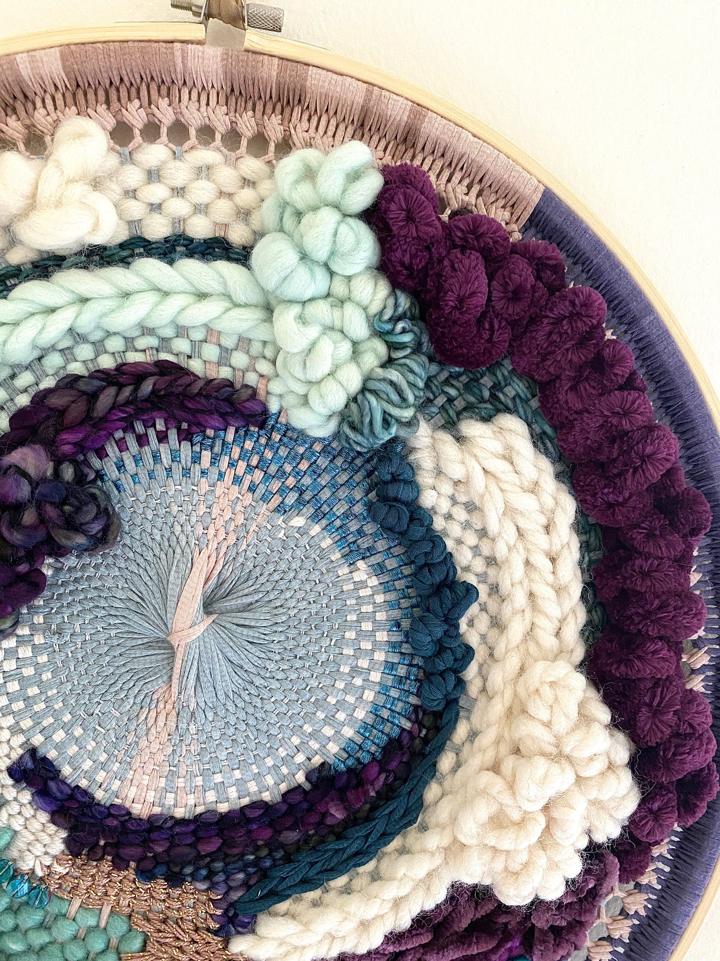 Plum clouds round woven wall hanging