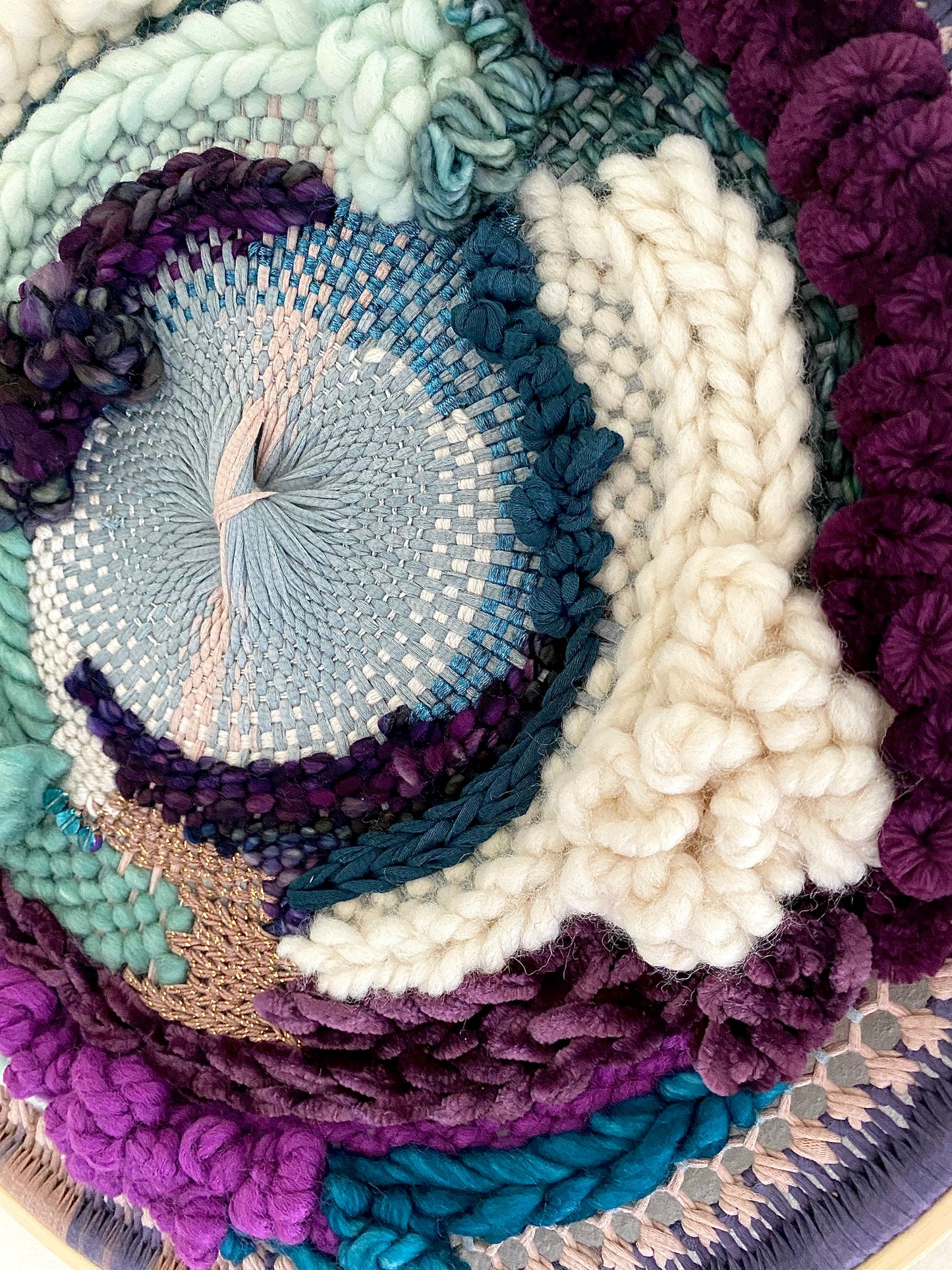 Plum clouds round woven wall hanging