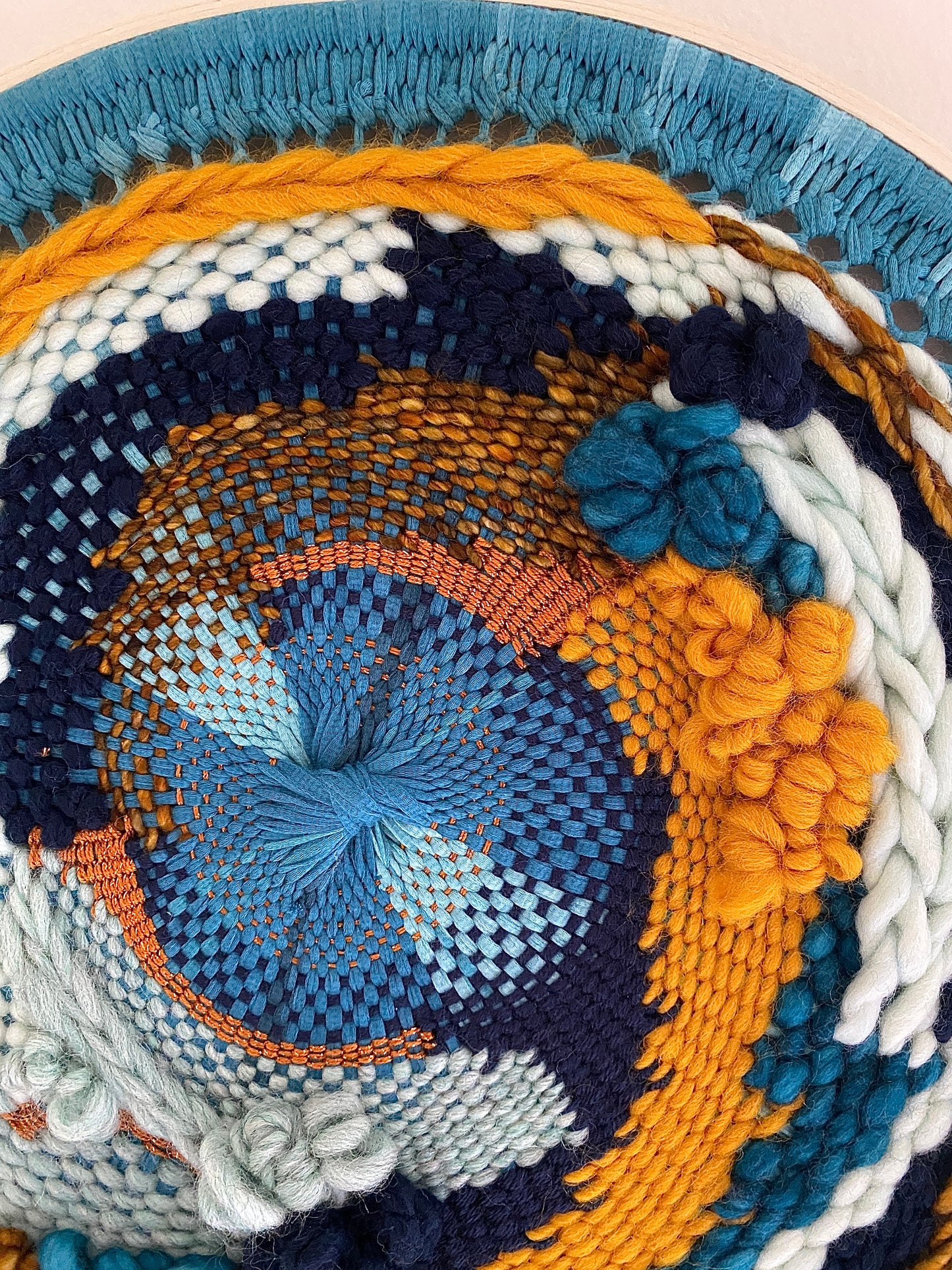 "Whirlpool" round woven wall hanging